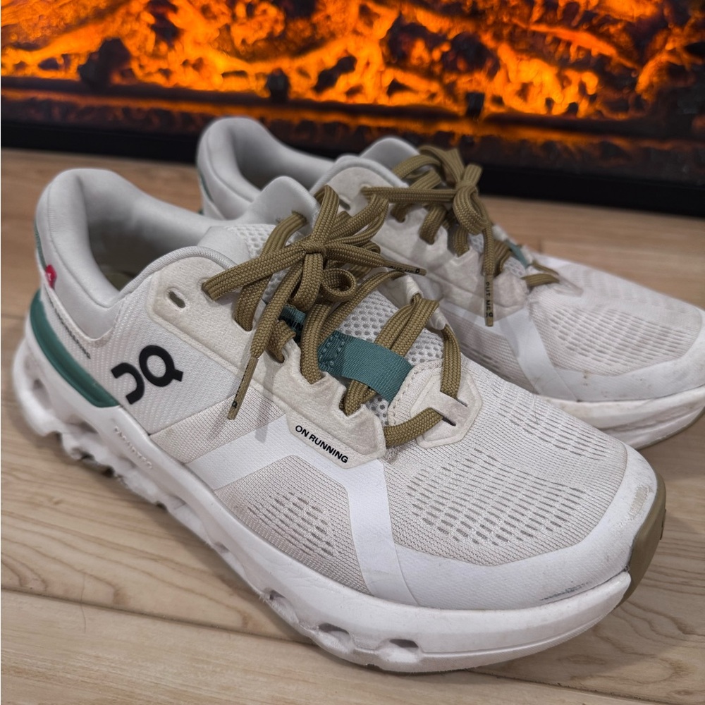 On Running Cream and Green Athletic Shoes